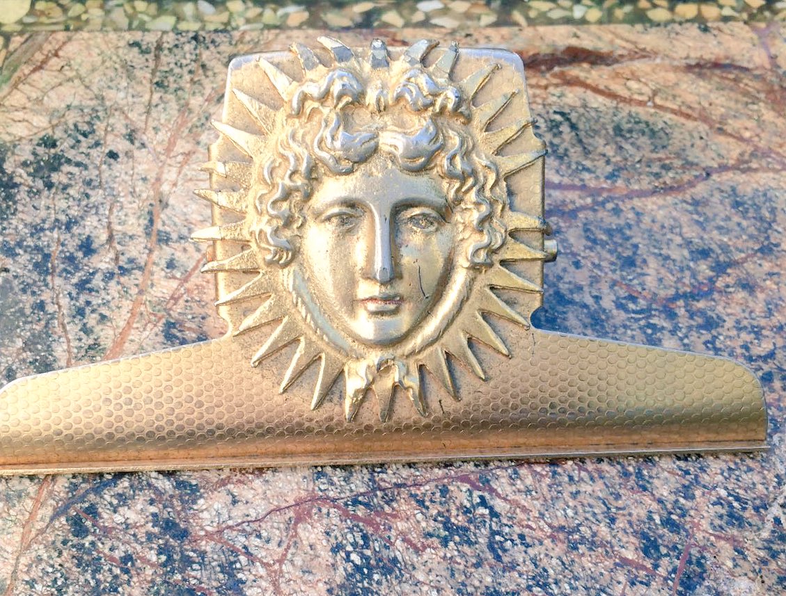 quirkitudinous's tweet photo. Beautiful old sun mask paper clip - ideal present for someone - £38 https://t.co/q9bjf8pwQk
