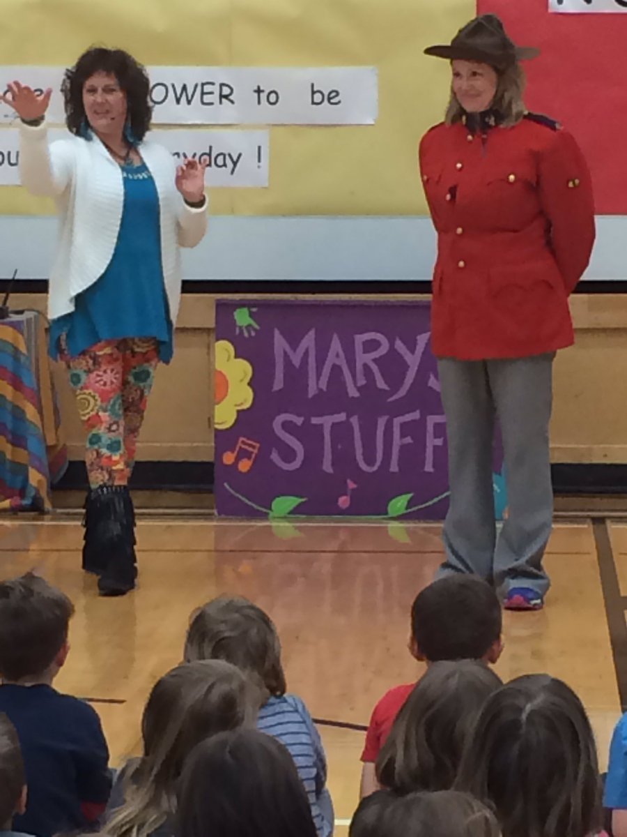 JDEschool's tweet photo. Mrs Daines helping Mary out to sing a song about the RCMP. She's a good sport! https://t.co/3WyQm4zm9j