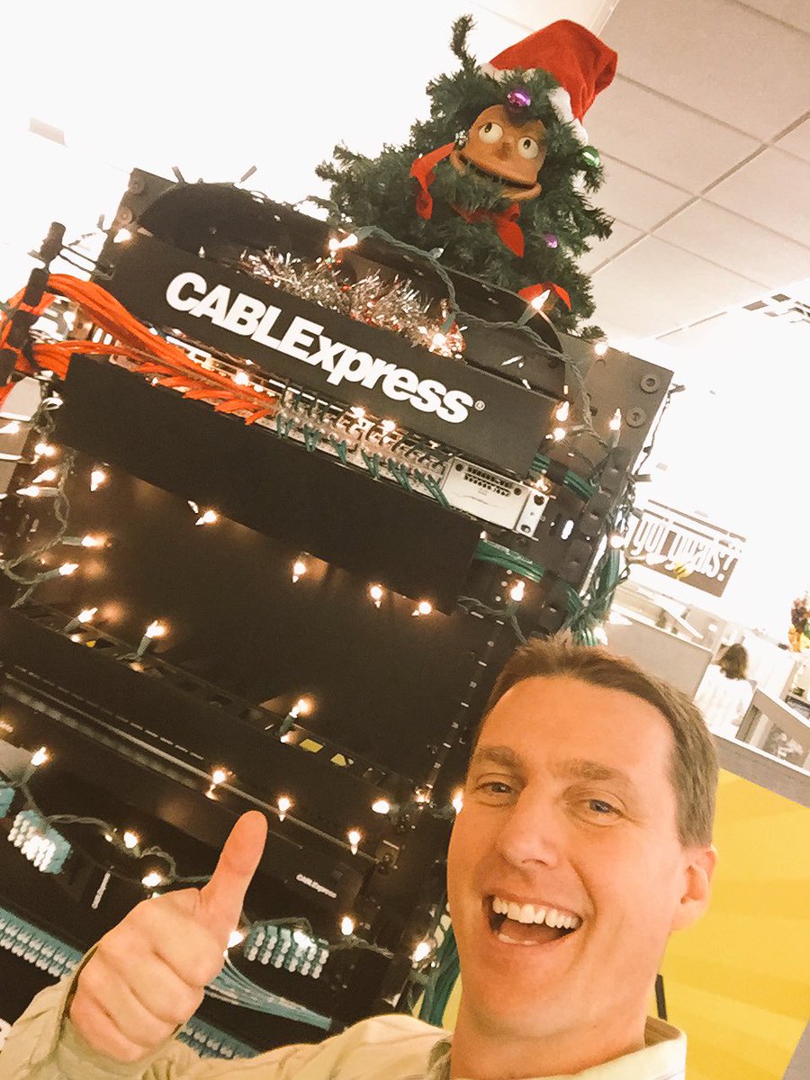 JTCableGuy's tweet photo. Holiday rack is set up in the atrium of @CXtec. Bartholomew resides at the top and will sing to anyone that needs a little holiday spirit! https://t.co/PxFFIlWEgY