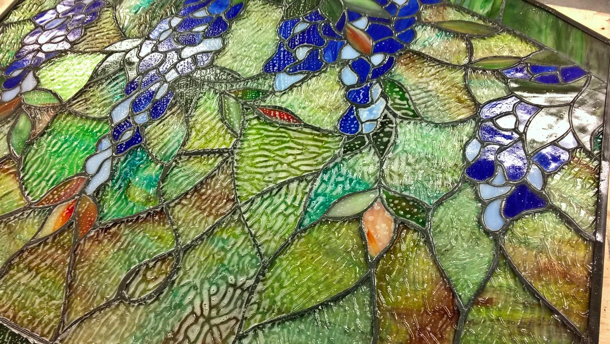 TransparentGS's tweet image. #Ontheworkbench for restoration - final clean of this copper-foil #stainedglass panel - detail colours/textures