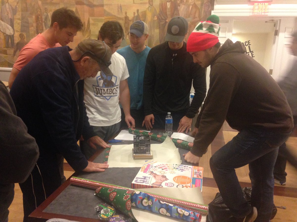 TuftsBaseball's tweet photo. Santa and his elves hard at work at the Holiday gift wrapping party! https://t.co/zdCYXnJKqO