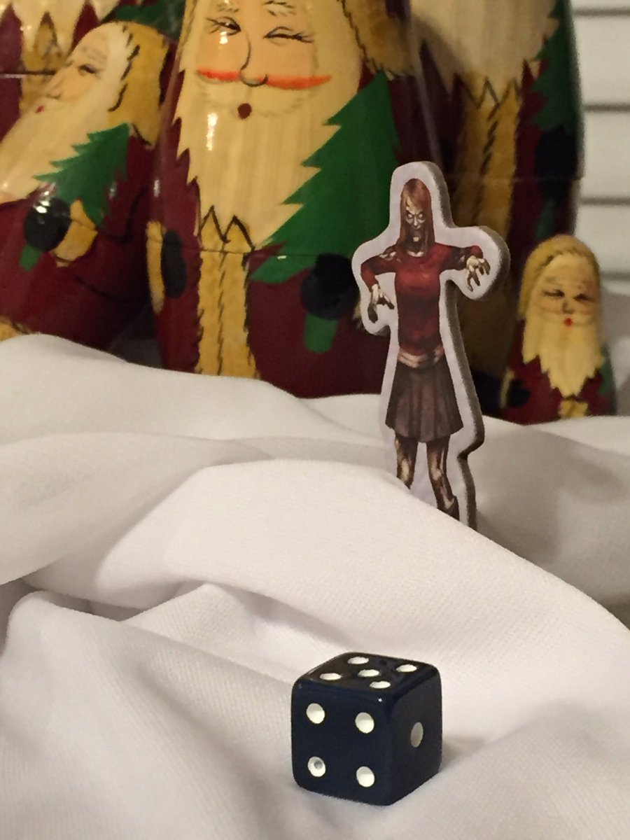 AmyM_Cook's tweet image. Tabletop gaming "tree" is up (courtesy my camera tripod, wrapping paper, garland and game components)!!