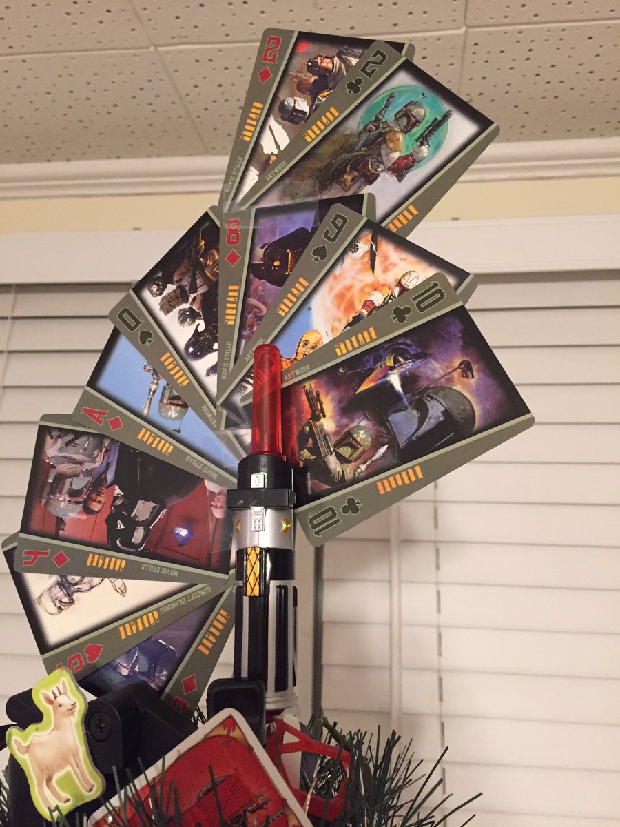 AmyM_Cook's tweet image. Tabletop gaming "tree" is up (courtesy my camera tripod, wrapping paper, garland and game components)!!