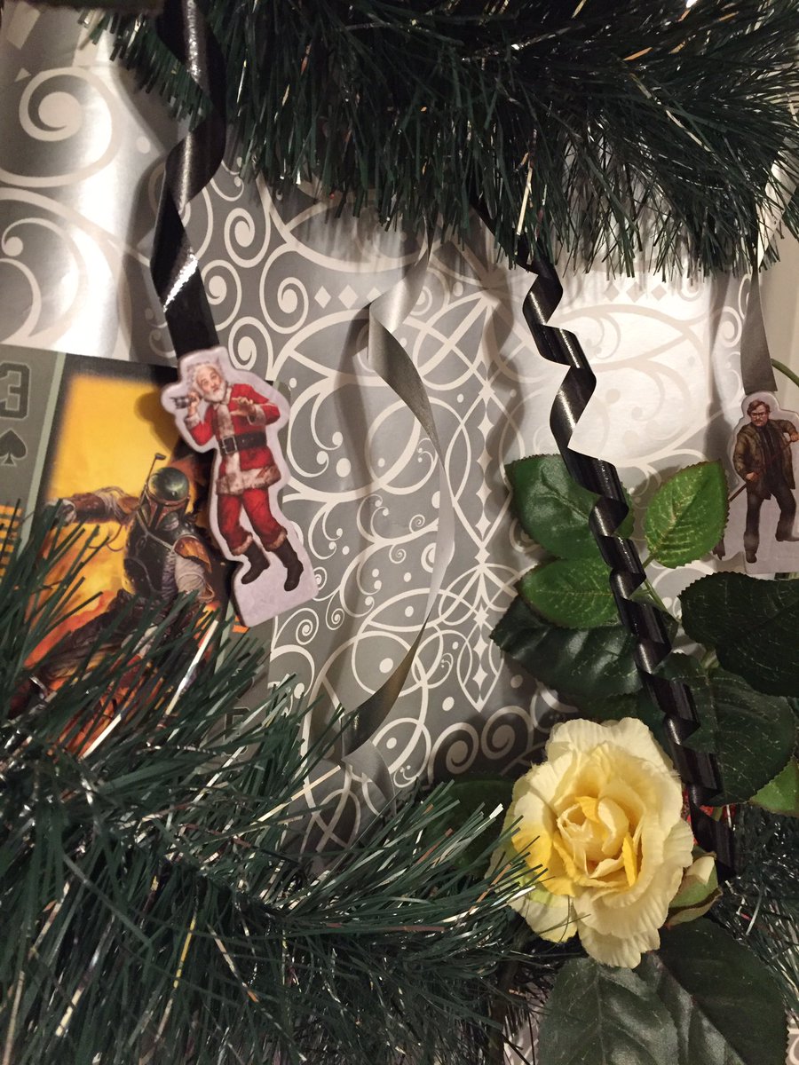 AmyM_Cook's tweet image. Tabletop gaming "tree" is up (courtesy my camera tripod, wrapping paper, garland and game components)!!
