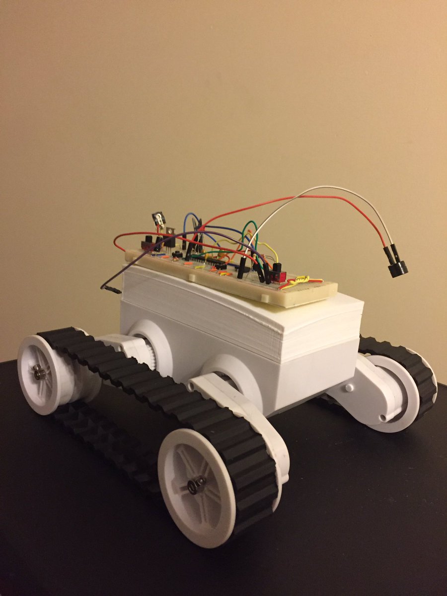 Tank-tracked robot that reads direction/speed instructions from an external flash chip. Too bad my software wasn't complete for the demo.