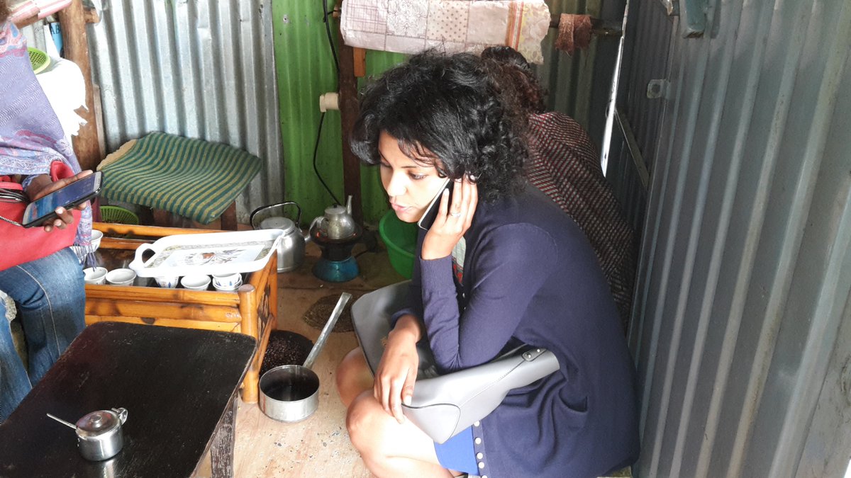 Multitasking in action - Ethiopian Women in Ag research and development Discussing while enjoying Eth. Coffee