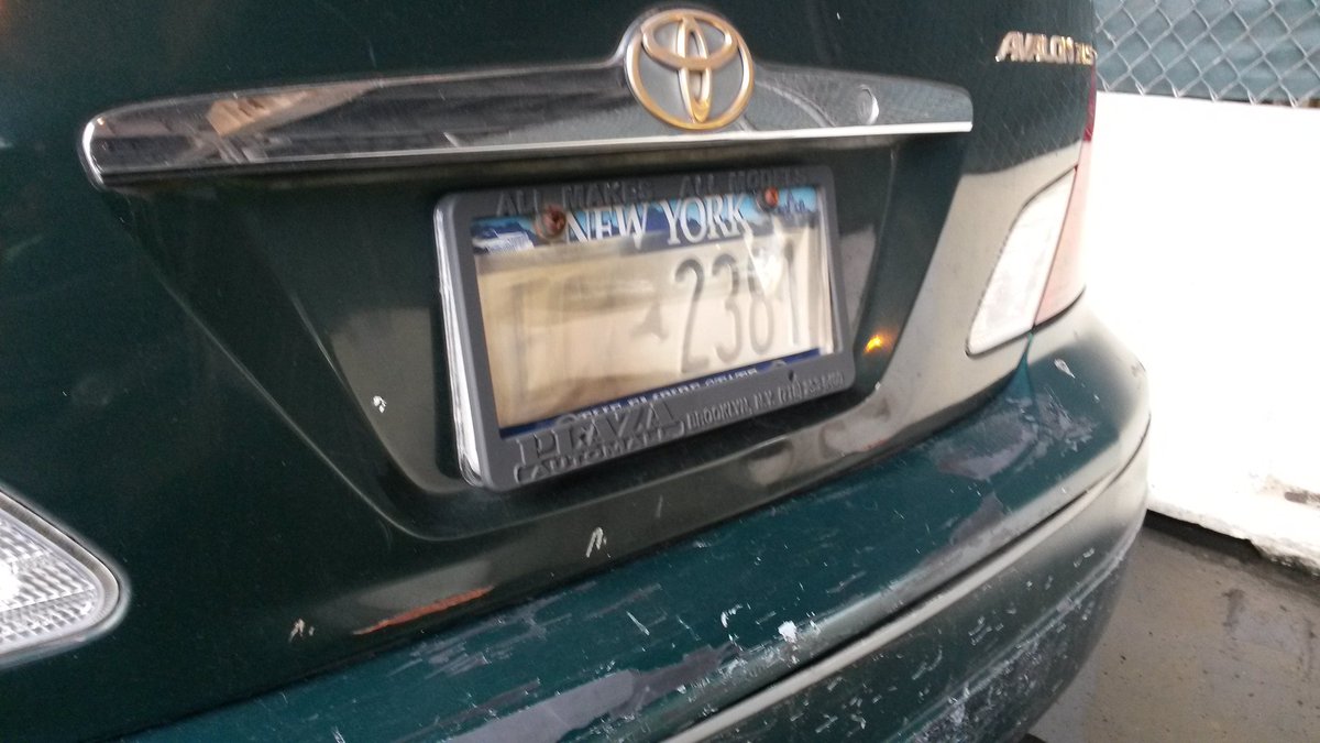 placard corruption on Twitter "Illegal license plate cover, expired