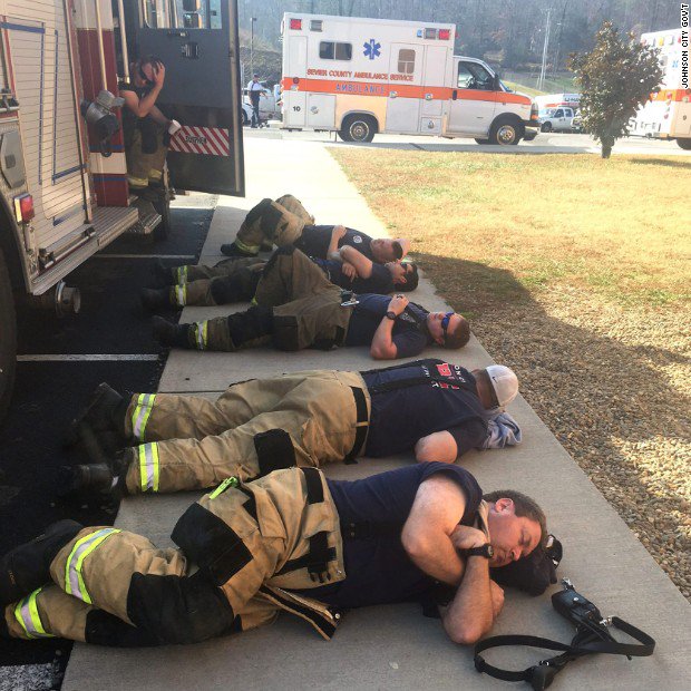 CNN's tweet photo. This photo shows the toll that the Gatlinburg wildfires take on those fighting them https://t.co/pstE3lfIIM https://t.co/cXVuq1eabL