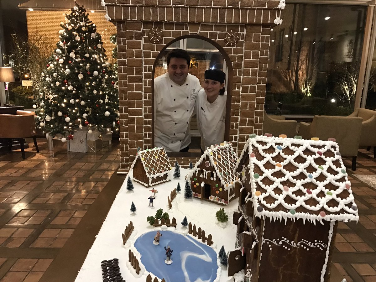 SopwellHouse's tweet image. Our pastry team with their gingerbread village and Sopwell Arch