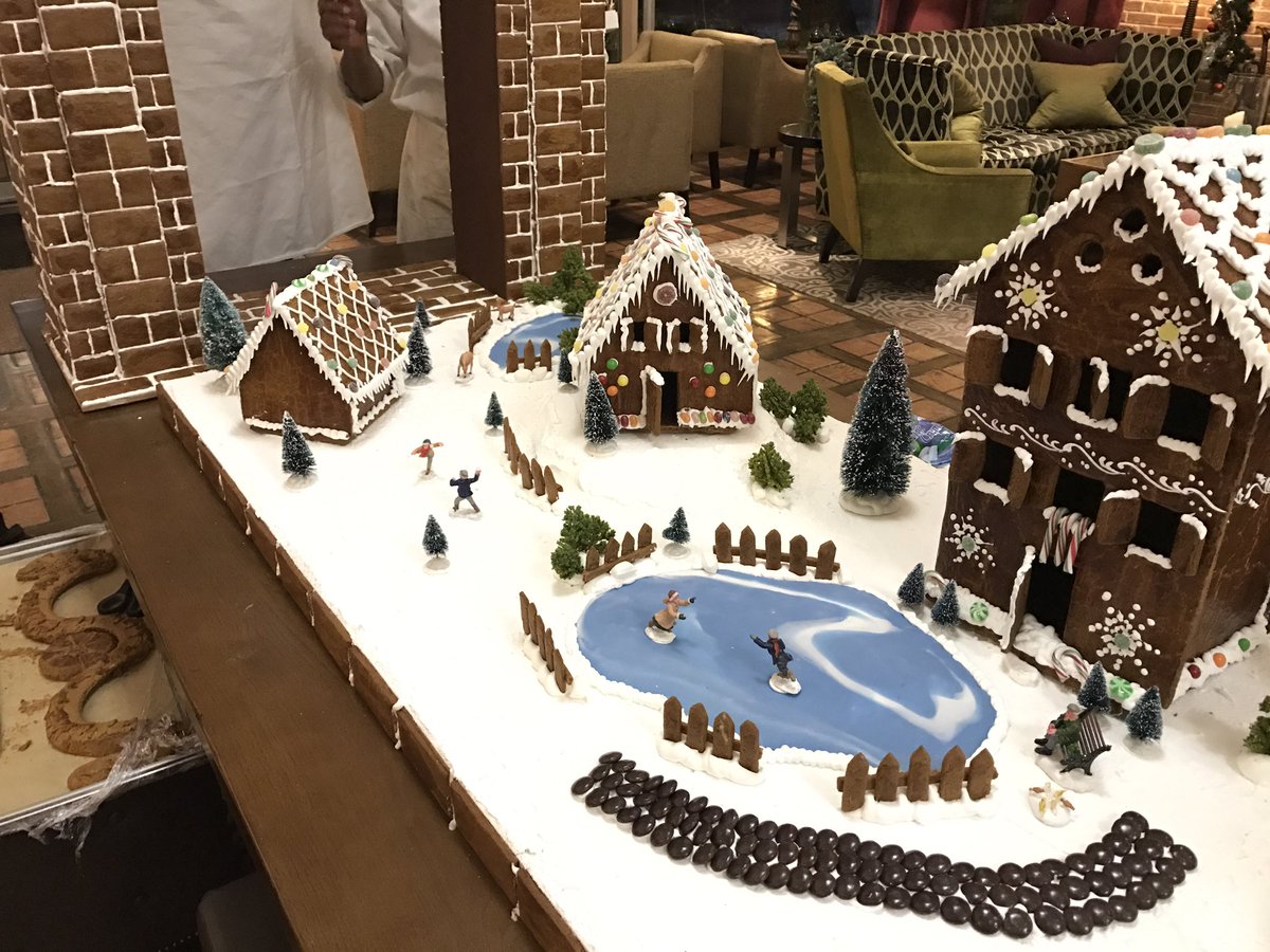 SopwellHouse's tweet image. Our pastry team with their gingerbread village and Sopwell Arch