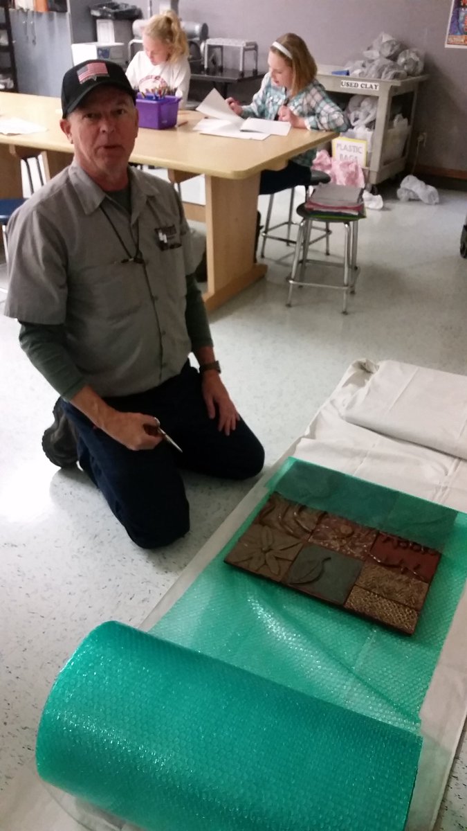 SchrammLovesArt's tweet photo. Soooo excited!  Mr. Bremer is here packing up our ceramic tile panels to be hung at #RWSSC #nmsstangs https://t.co/4HVBRz8Vzy
