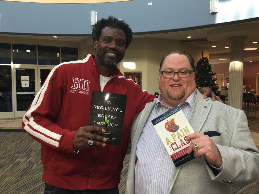 <a href="/Resilience_Guy/">Christian Moore</a> and <a href="/hustleu/">Hustle University</a>  exchange books at #ResilienceSummit2016
