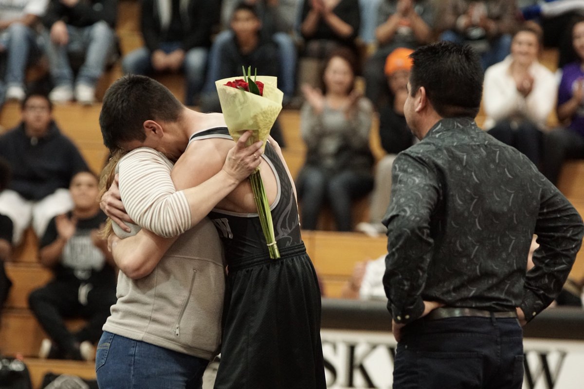 MapletonSchools's tweet photo. Senior wrestler Alan A. celebrates #SeniorNight with his parents at last night’s season home opener. #GoSkyview https://t.co/Z0dMtOaAJy