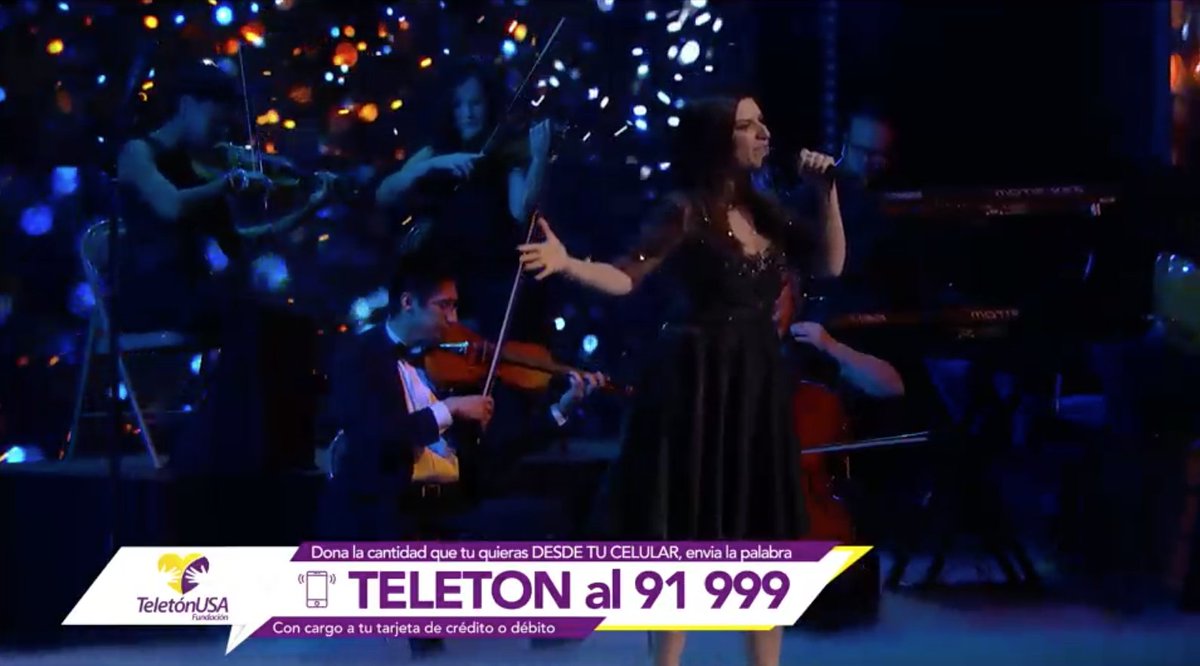 Univision's tweet photo. .@LauraPausini en el escenario de @TeletonUSA 💛💜 #NuestraCausa https://t.co/0ftJH0MLUZ