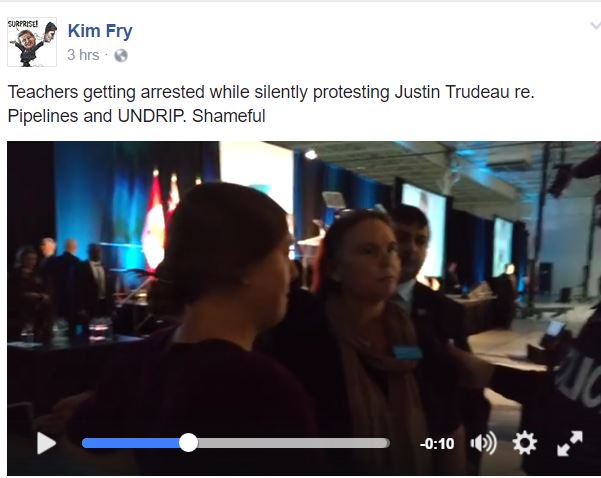For_the_Coast's tweet photo. BREAKING! Teacher with baby arrested for holding "No Pipelines" banner at #Trudeau appearance at a school. https://t.co/ZINfFicuEw #StopKM https://t.co/tiWkL0hs30