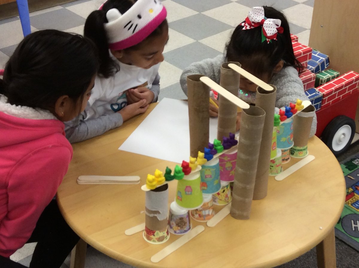 Teacher_Roberts's tweet photo. Engineers in rms 1 &amp; 24 collaborating to design &amp; build a bridge that'll hold 21 'elephants' after listening to the story. #dvlions https://t.co/cQpTe80W4n