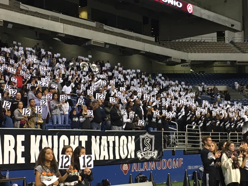 SCUCISD's tweet photo. Steele HS fans hold up #12 to honor Churchill's fallen teammate Josh Pollard during the Chargers' school song. #UnitedInLove #WeAreSCUC https://t.co/uTuO3yMh9O