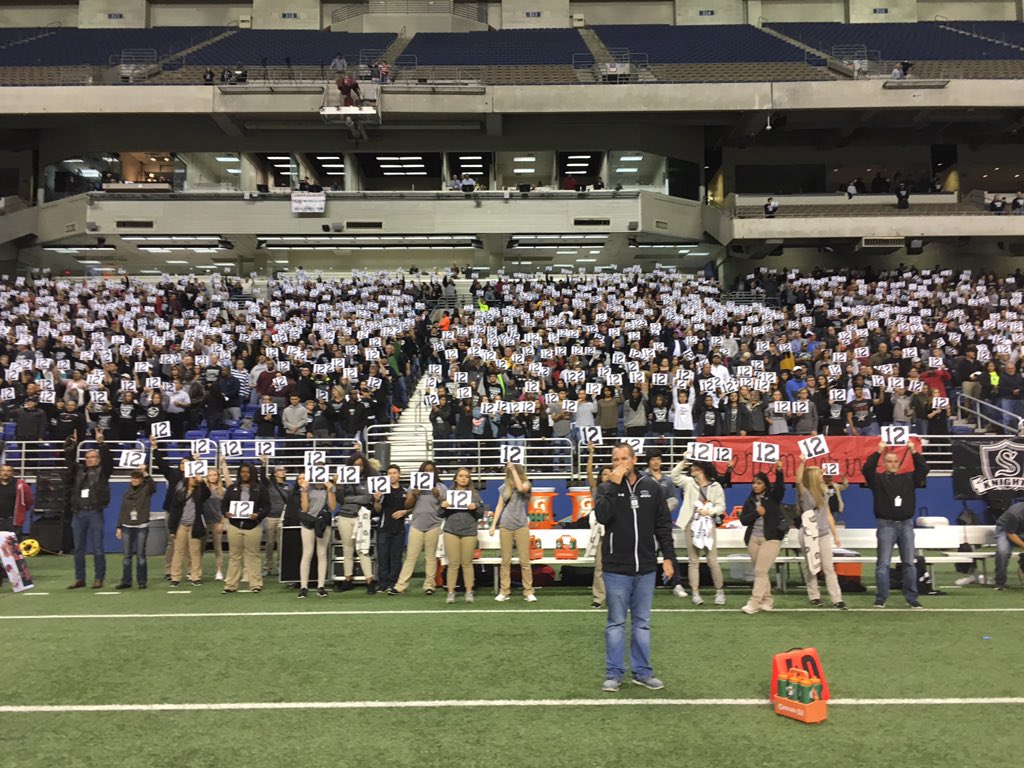 SCUCISD's tweet photo. Steele HS fans hold up #12 to honor Churchill's fallen teammate Josh Pollard during the Chargers' school song. #UnitedInLove #WeAreSCUC https://t.co/uTuO3yMh9O