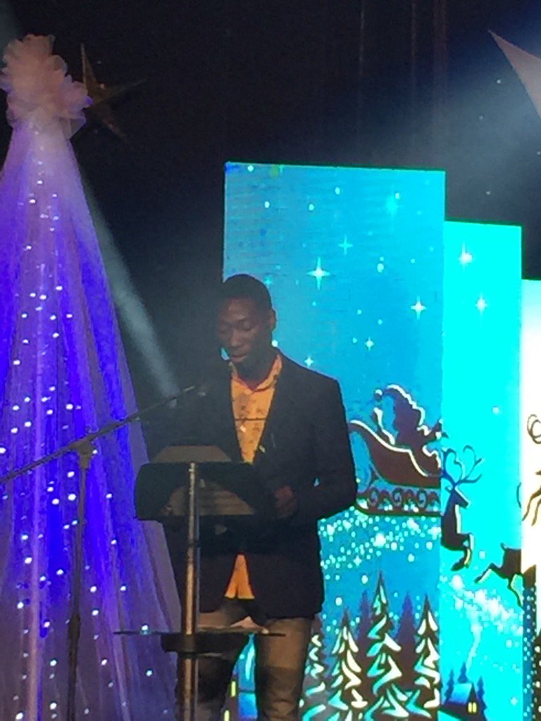 Security Officer Reginald Adjei Okine reads the sixth lesson. Another member of the MTN family #MTNCarols2016