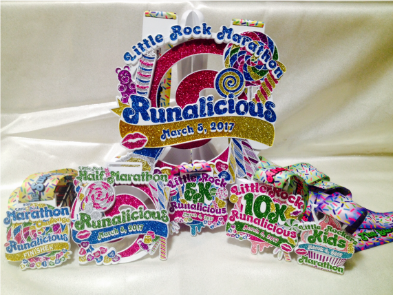 LRMarathon's tweet photo. #LRMarathon unveils #Runalicious medals. https://t.co/ffxukSDxwL #GinaandGeneva @ArkansasOnline @LRParksRec @LittleRockCVB  @HastyAwards https://t.co/YFNfyPWRae