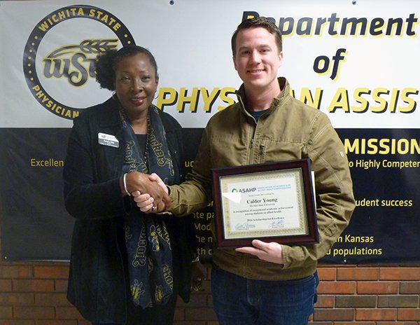 Congrats to <a href="/Shocker_PA/">WSU PA Program</a> student Calder Young who was presented with the prestigious <a href="/ASAHPDC/">ASAHP</a> Scholarship for Excellence by Dean <a href="/sbibb_bibb/">Sandra Bibb</a>.