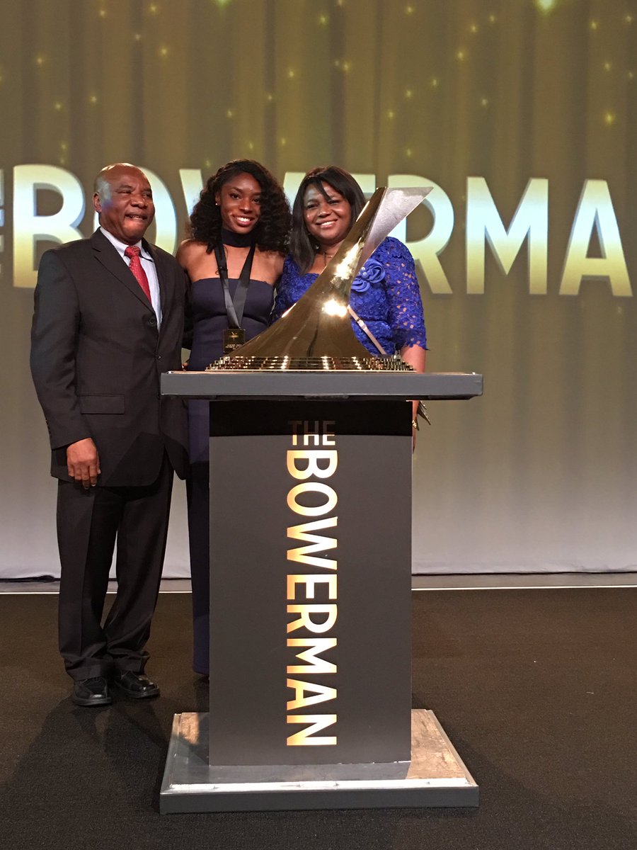 Proud parents David &amp; Comfort Okolo with Courtney and The Bowerman trophy. Thank you! #HookEm 🤘🏆