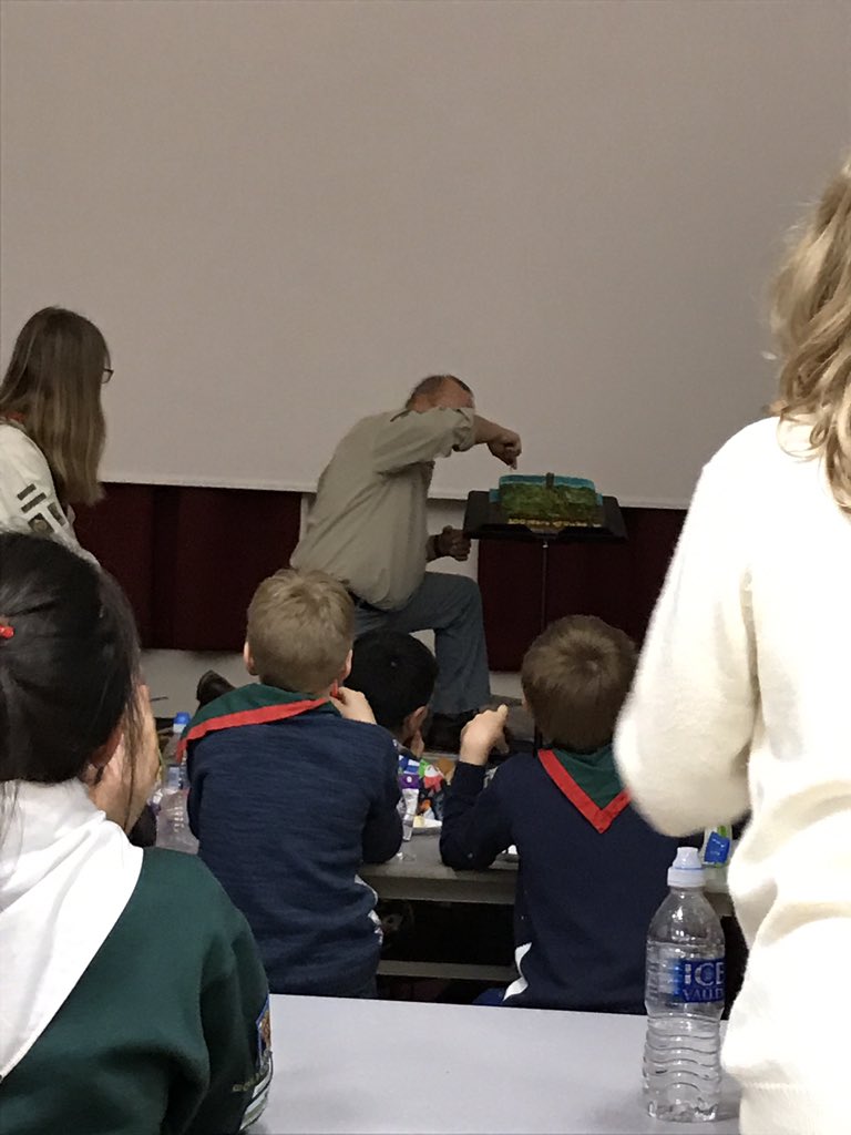 Our DC trying to cut the birthday cake