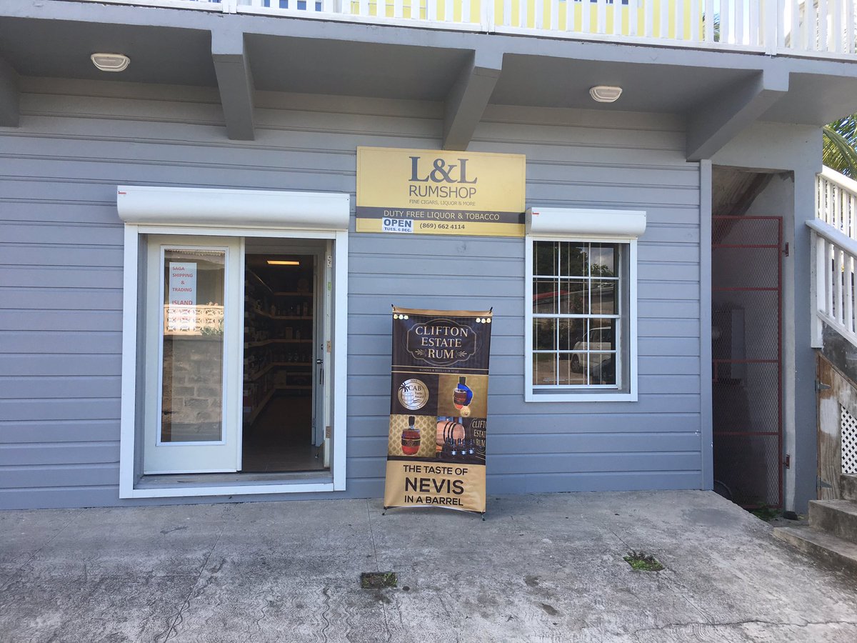 marksrumtasting's tweet photo. Open for business, L&amp;L Rumshop, Charlestown, Nevis. Duty free @NevisNaturally @FSNevis @MontpelierNevis @Nisbet_Nevis @HermitageNevis https://t.co/7yrt9cambb