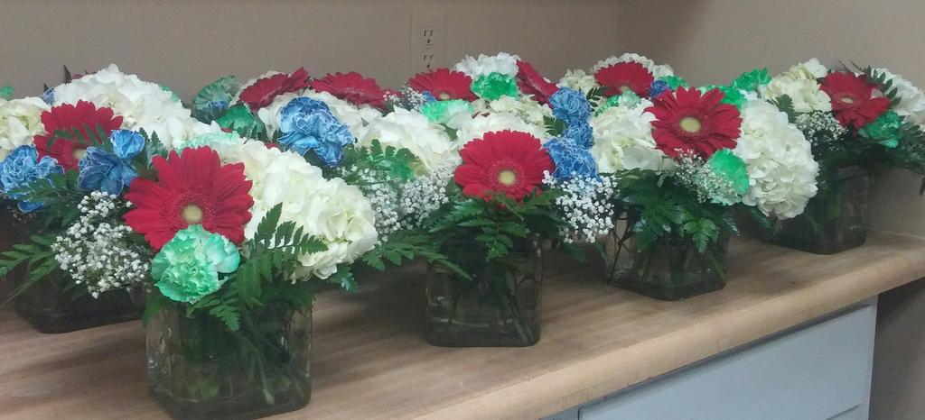 Event flowers we did for Hendricks Regional Health..Plainfield colors red white and blue and green for HRH..😀😀😀