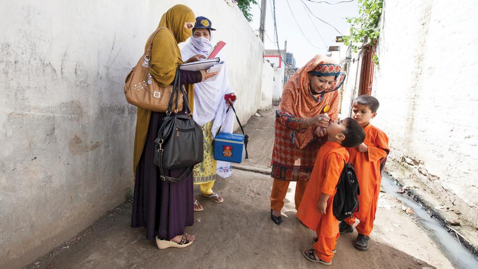 Rotary's tweet image. Health workers and #Rotary members work together to immunize a population on the move against polio. #endpolio on.rotary.org/2d9giEp