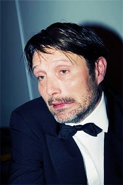 mads mikkelsen always looks like he's either insanely drunk & ready to party more or insanely drunk but trying to look sober for a pic