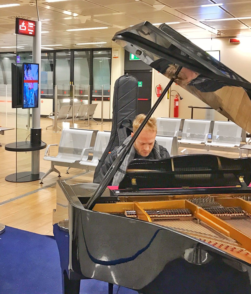 RotemSivan's tweet photo. Piano moment in the airport! On our way to Brussels! #wintertour2016 #rotemsivantrio https://t.co/SvvKaBqsli