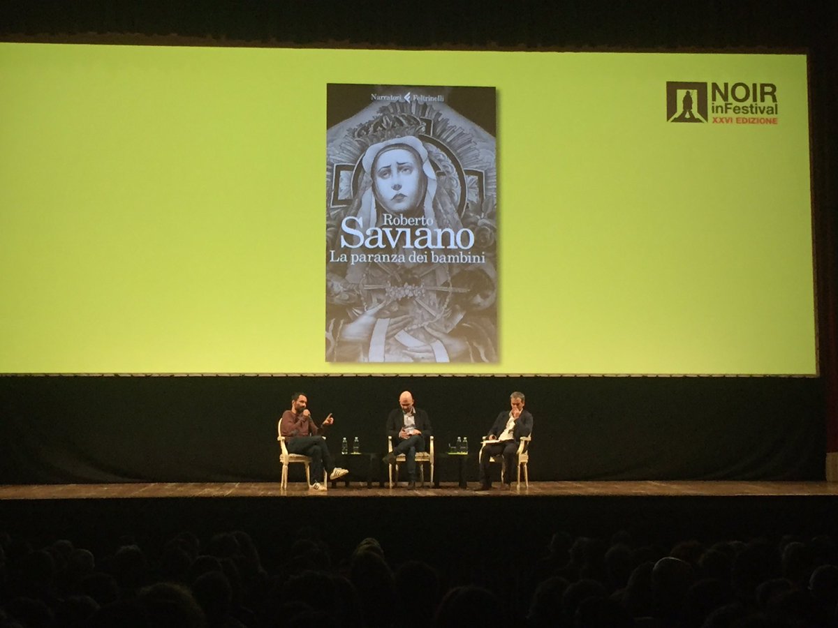 GretaMessori's tweet photo. Al @NoirInFestival sul palco del Teatro Sociale di Como @robertosaviano con @triulziseb &amp; @Boosta https://t.co/n1ZskNF4Po