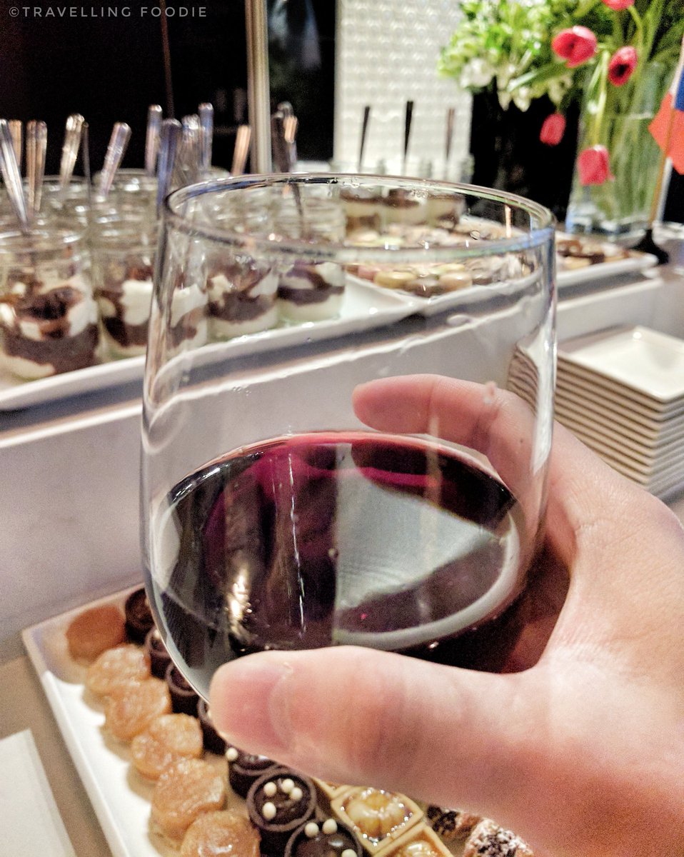 Travelling Foodie drinks wine at Mastercard Cash Passport Preview Night at The One Eighty