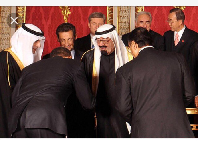 's tweet image. kissing Saudi King's ring.