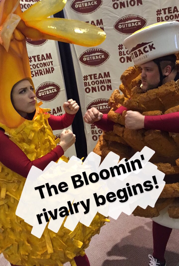 Outback's tweet image. Bloomin' Onion Man &amp;amp; Coconut Shrimp Girl are back at it. #everyonewins at the @outbackbowl on Jan 2nd