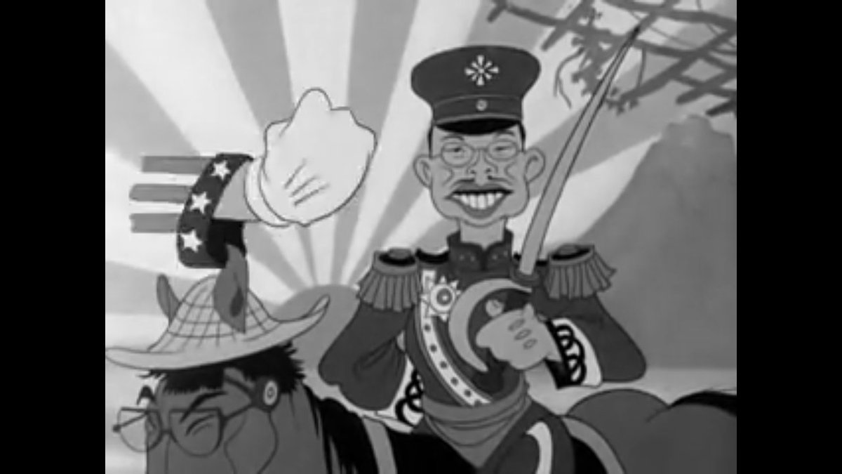 もす 6枚目 戦時中のアメリカのアニメに登場した昭和天皇 このあと左に見てるアメリカの拳で殴られる