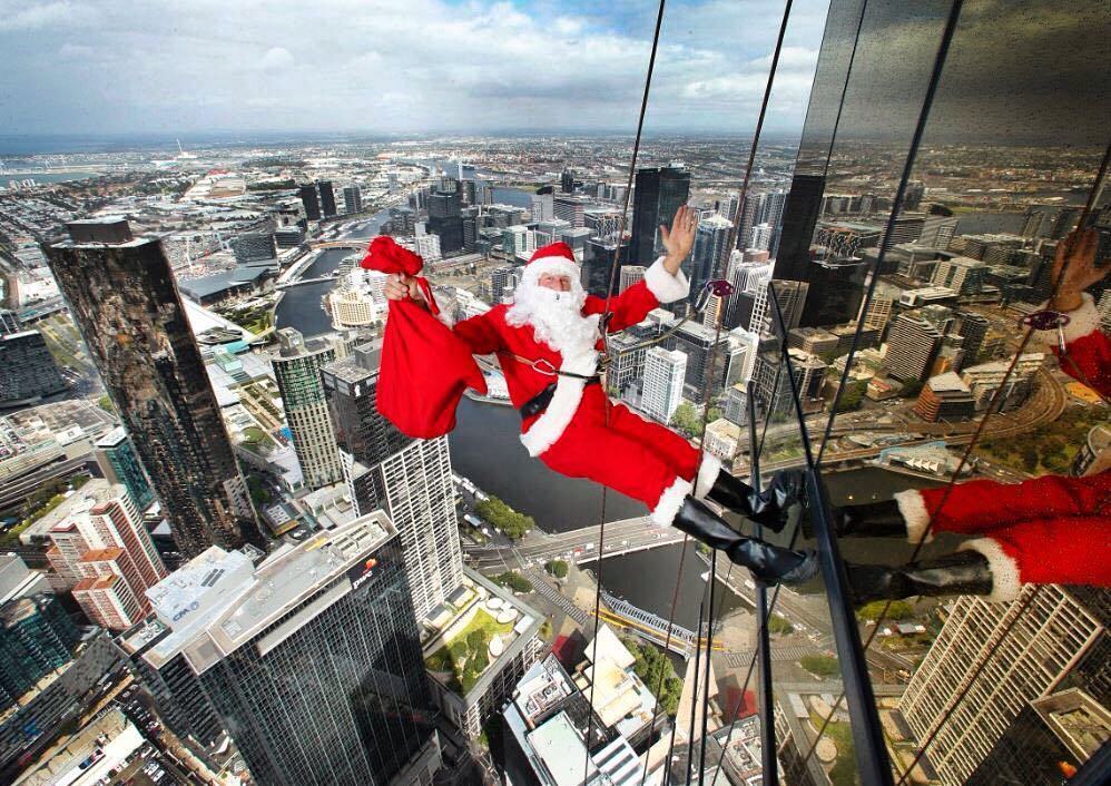 heraldsunphoto's tweet photo. Santa Claus, (aka high rope access climber Chris Davies) with a sack of presents, scales d… https://t.co/IimiWAVfin https://t.co/4zOnL8IQxr