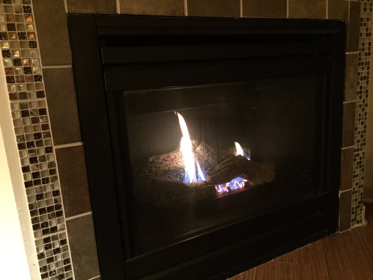 KaraAmundson's tweet image. Checking out the fireplace for the first time in my apt. #hatebeingcold #firegood #yolo #warm