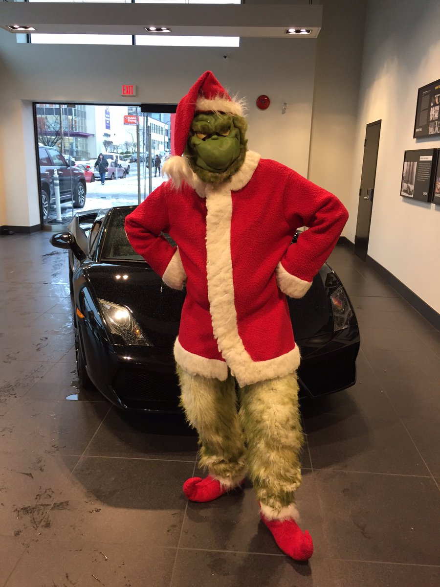 VanFoodBank's tweet image. The #grinch checking out cars @LamborghiniVan. He looks skeptical, but a donation to @VanFoodBank might change his mood.