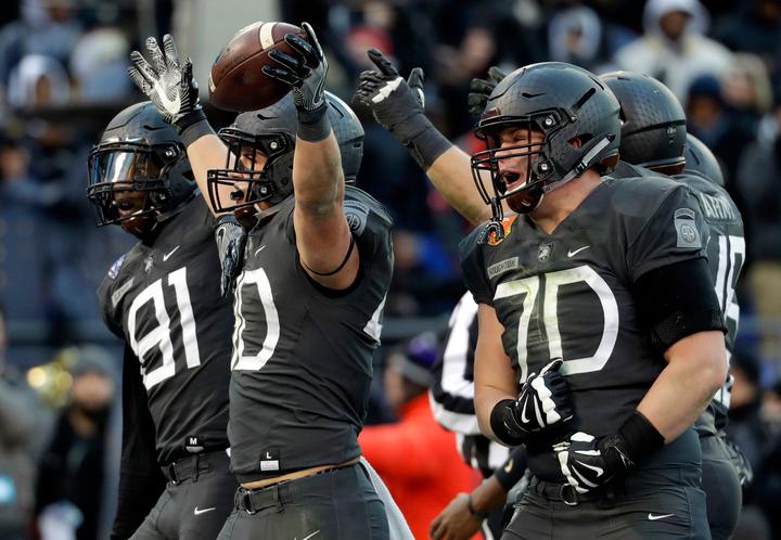 espn's tweet photo. At long last, it's over!

With a 21-17 victory, Army beats rival Navy for the first time in 15 years. https://t.co/i0DlxNnnC5