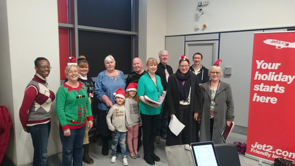 ichesworth's tweet photo. Manchester @AIRPORT_CHOIR singing for the @jet2tweets #searchingforsanta https://t.co/tifTX3S3Tj