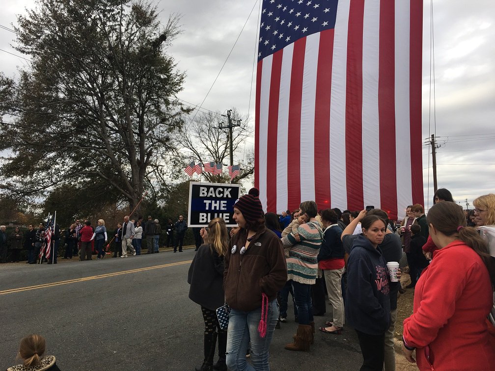 GoodDayAtlanta's tweet photo. The Americus community honors Officer Nicholas Smarr, who was killed in the line of duty this week, along with Officer Jody Smith. #fox5atl https://t.co/XV4hfSLSQJ