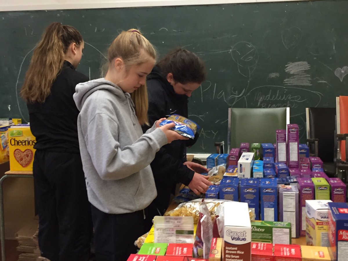 ReprtrPatHealey's tweet photo. The girls hard at volunteering to check the expiry dates on items collected for the Lions Christmas Express in #FallRiverNS #MetroWestForce https://t.co/3sOKrSzkdY