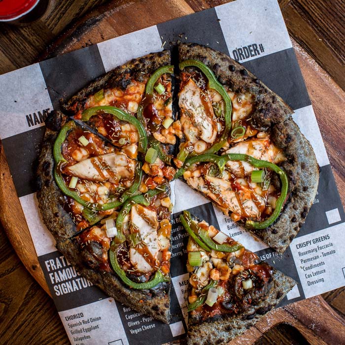 Turkey, cranberry BBQ sauce, red onions &amp; green capsicums - it's Christmas on a pizza. And it's for a good cause: bit.ly/2gKR1AP