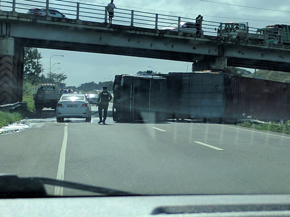 CNC3TV's tweet image. A trailer has overturned on the Uriah Butler Highway southbound near Claxton Bay.
