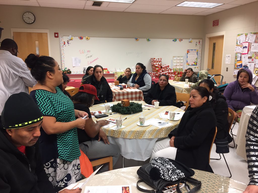 Parent meeting at Dudley family school talking spreading holiday cheer and taking quality schools and education!