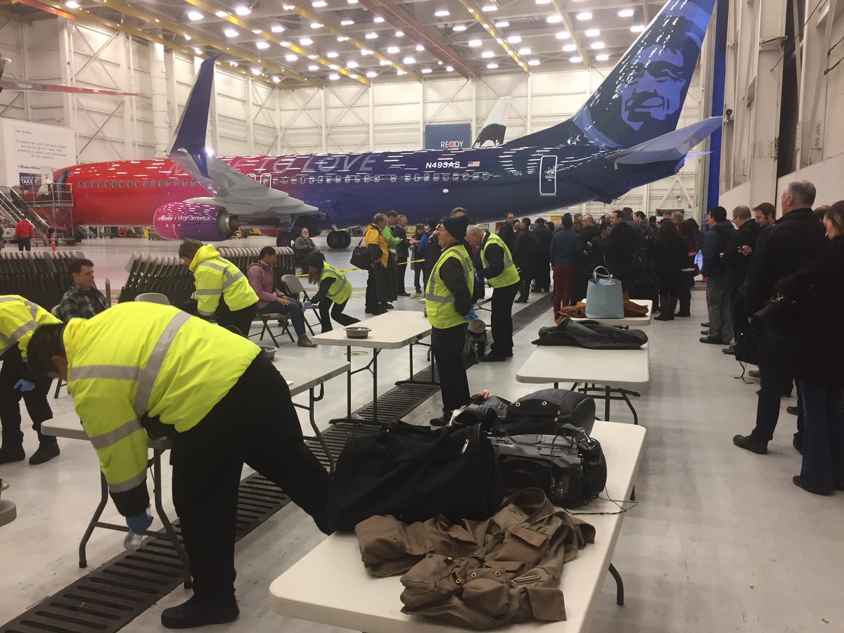 mattmarkovich's tweet photo. This is what TSA charter flight screening looks like inside a hanger Lots of #patdowns & #wanding @Craigkomo @davidwilke #komonews https://t.co/MbIllevSsJ