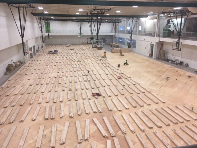 MedHatHigh's tweet photo. It'll be hard to keep the MHHS basketball teams out of the gym once the new hardwood floor is done! #MHHSModernization #GrahamConstruction https://t.co/npPivE1psL