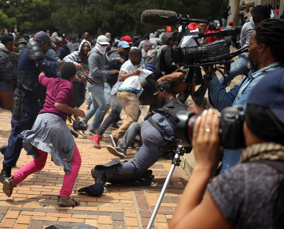 IFEX's tweet image. Why is #Fees2017 being compared to the #SowetoUprising? A reporter's view: bit.ly/2g27y6r @ewnreporter @News24 @HeraldPE @guyberger
